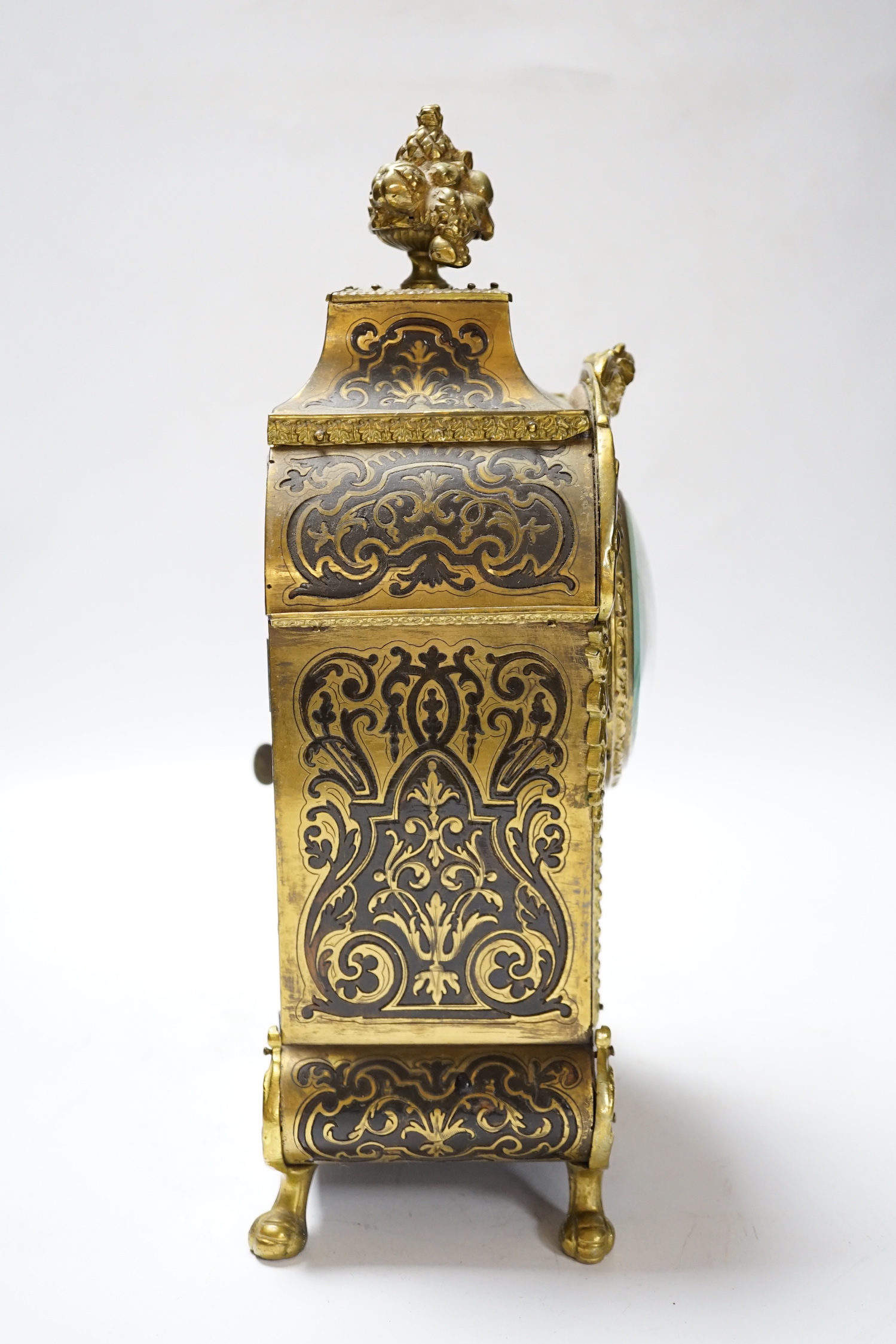 A late 19th century French cut brass inlaid mantel clock, 32cm high